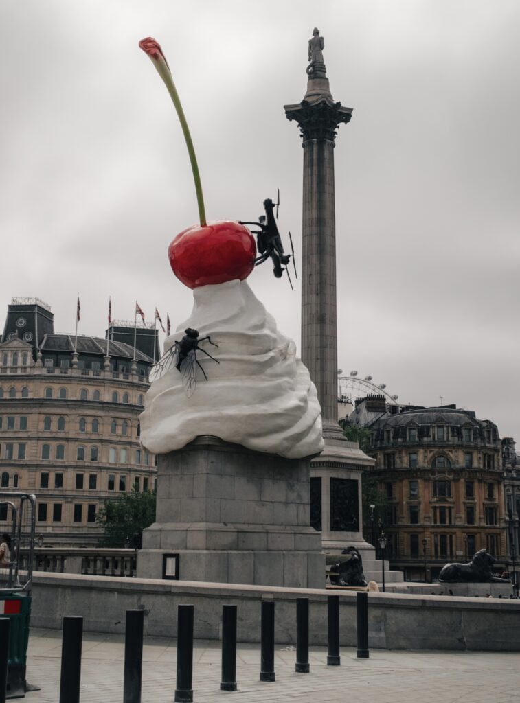 A sculpture of a drone on top of ice cream with a cherry as part of the Fourth Plinth installations in Trafalgar Square